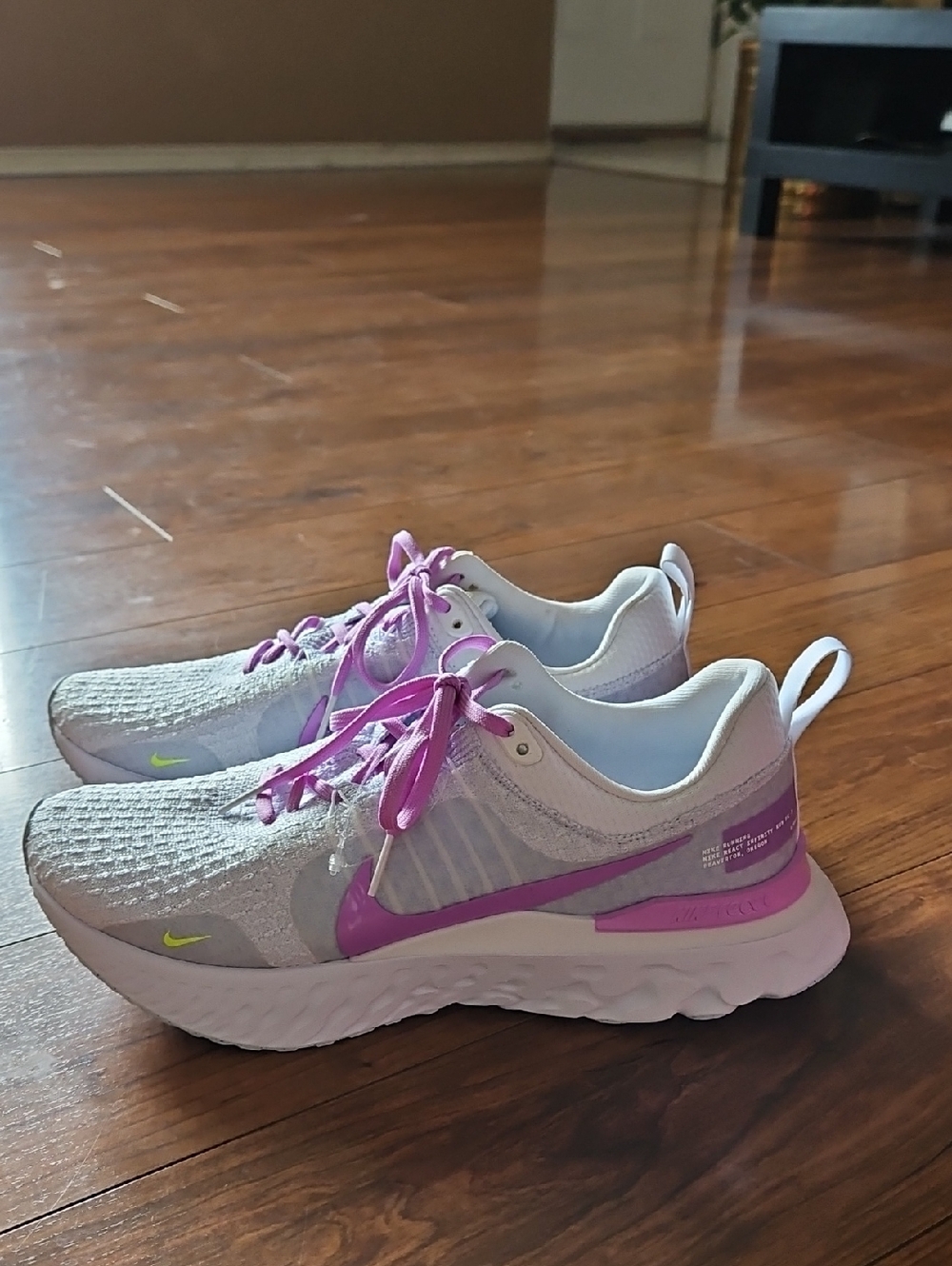 Nike Light Gray Running Shoes with Lilac Design.